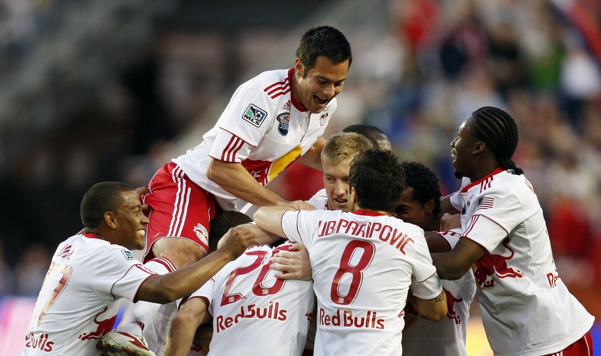 New York Red Bulls celebrate a goal by Joel Lindpere (20) during the first half of a soccer match against Santos FC Saturday, March 20, 2010, in Harrison, N.J. The Red Bulls won 3-1. (AP Photo/Mel Evans)    / SCANPIX Code: 436