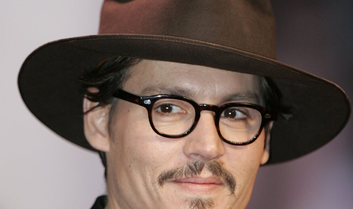 U.S. actor Depp poses during a news conference in Tokyo