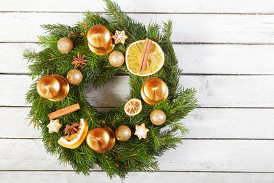 Christmas wreath on the wooden background