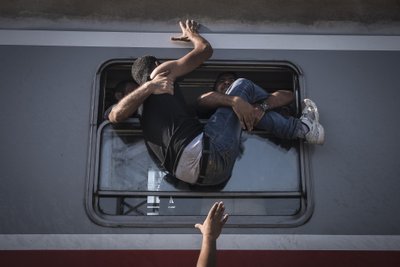 Põgenikud üritavad mahtuda Tovarnikust (Ungari) Zagrebisse (Horvaatia) sõitvale rongile. Pildistatud 18. septembril 2015.