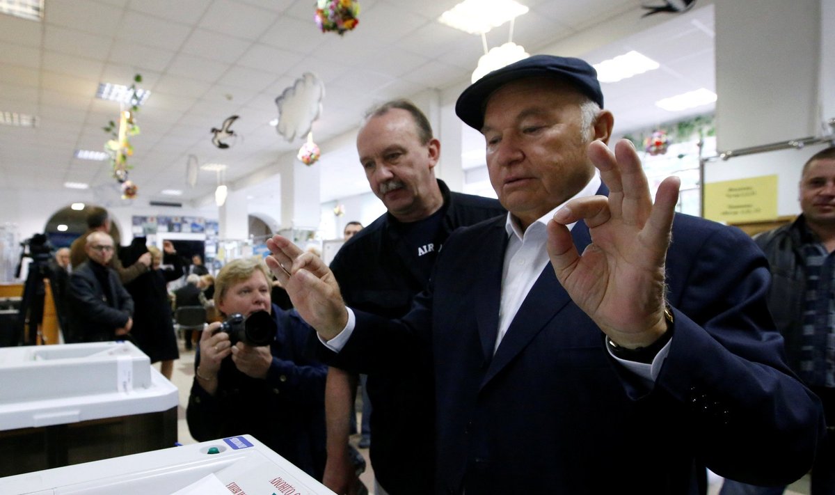 Former mayor of Moscow Luzhkov casts his ballot during parliamentary election in Moscow