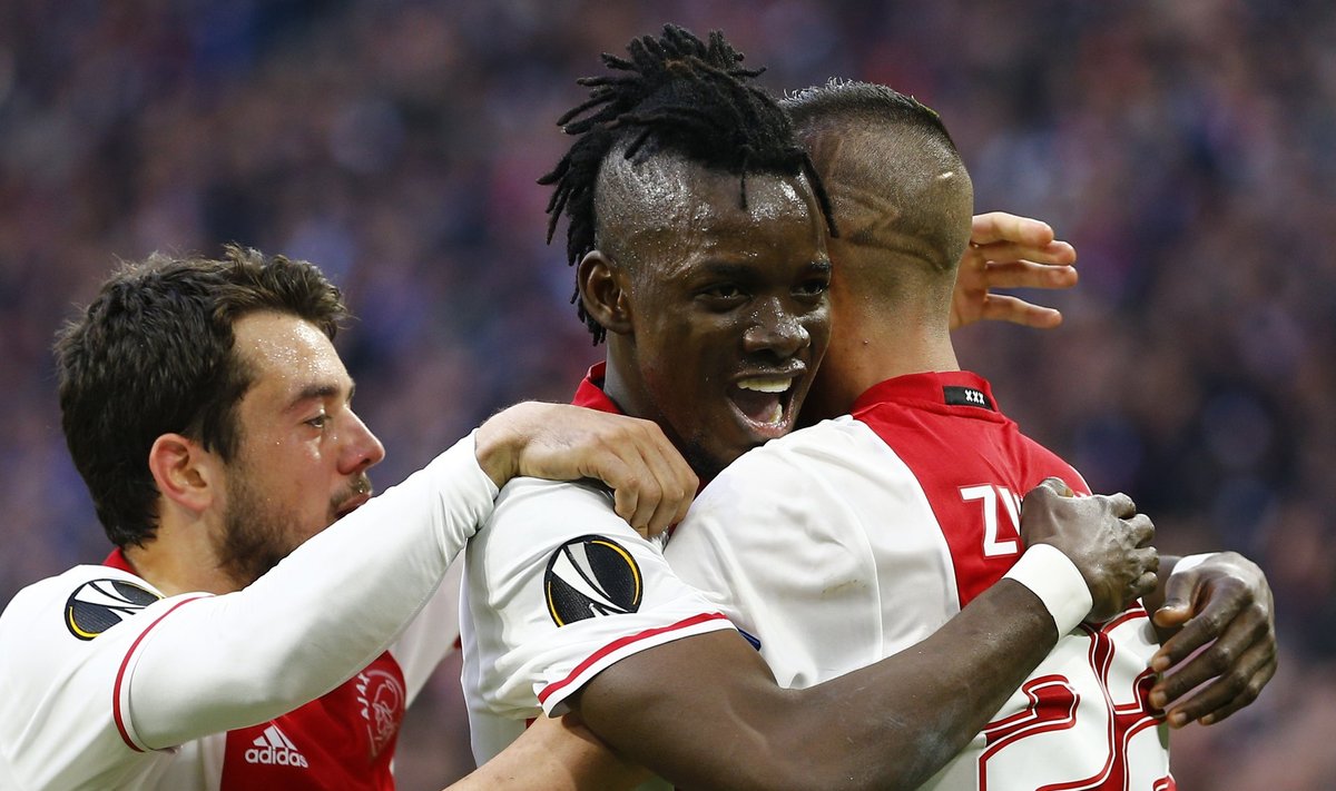 Ajax's Bertrand Traore celebrates scoring their fourth goal with team mates