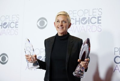 Ellen DeGeneres poses with her awards during the People's Choice Awards 2016 in Los Angeles