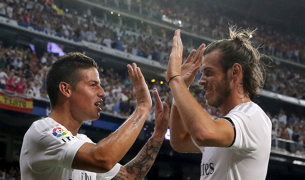 Real Madrid's Rodriguez celebrates his goal against Real Betis with teammate Bale during their Spanish first division soccer match at Santiago Bernabeu stadium in Madrid, Spain