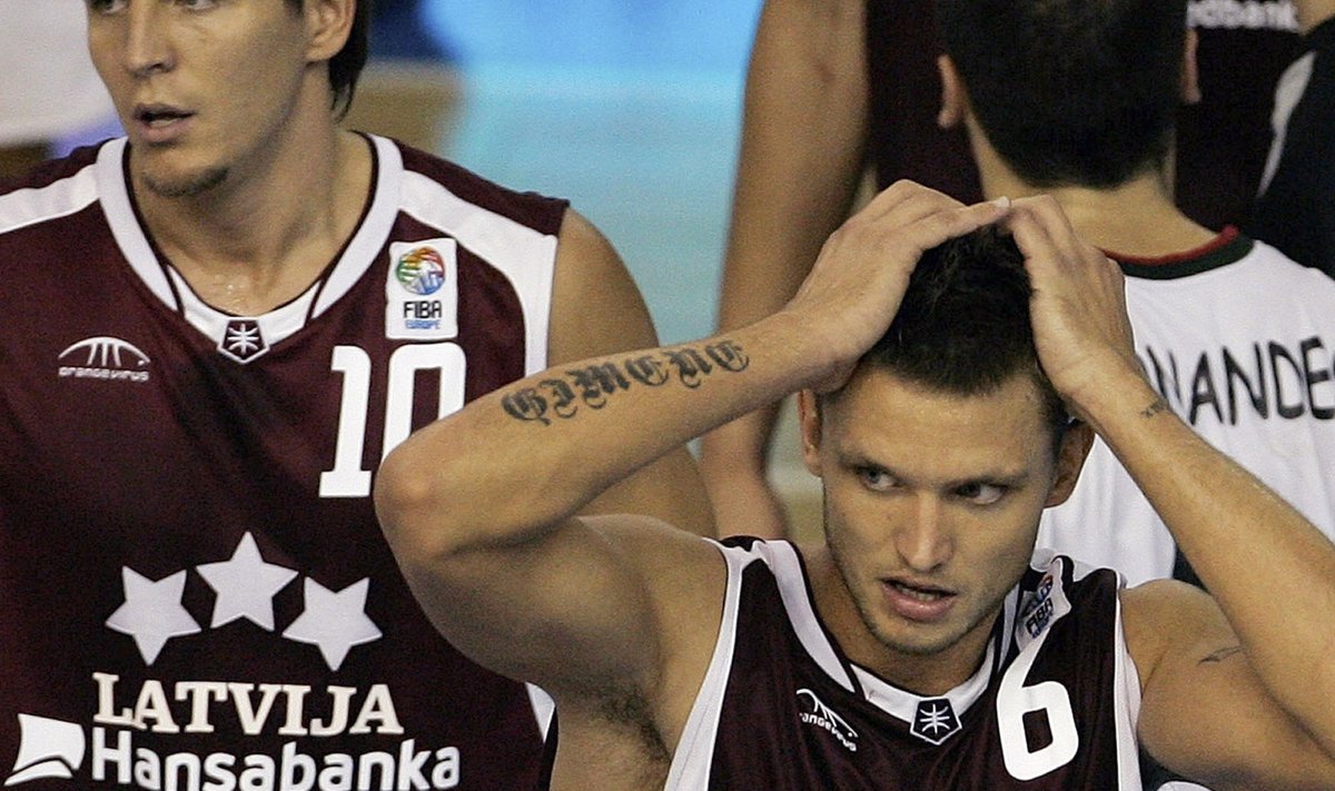 Latvia's Valters and Skele react after losing their European Championships game against Portugal in Seville