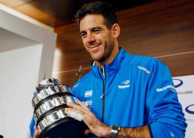 Juan Martin del Potro of Argentina's Davis Cup tennis team, holds a trophy after the team's arrival in Buenos Aires