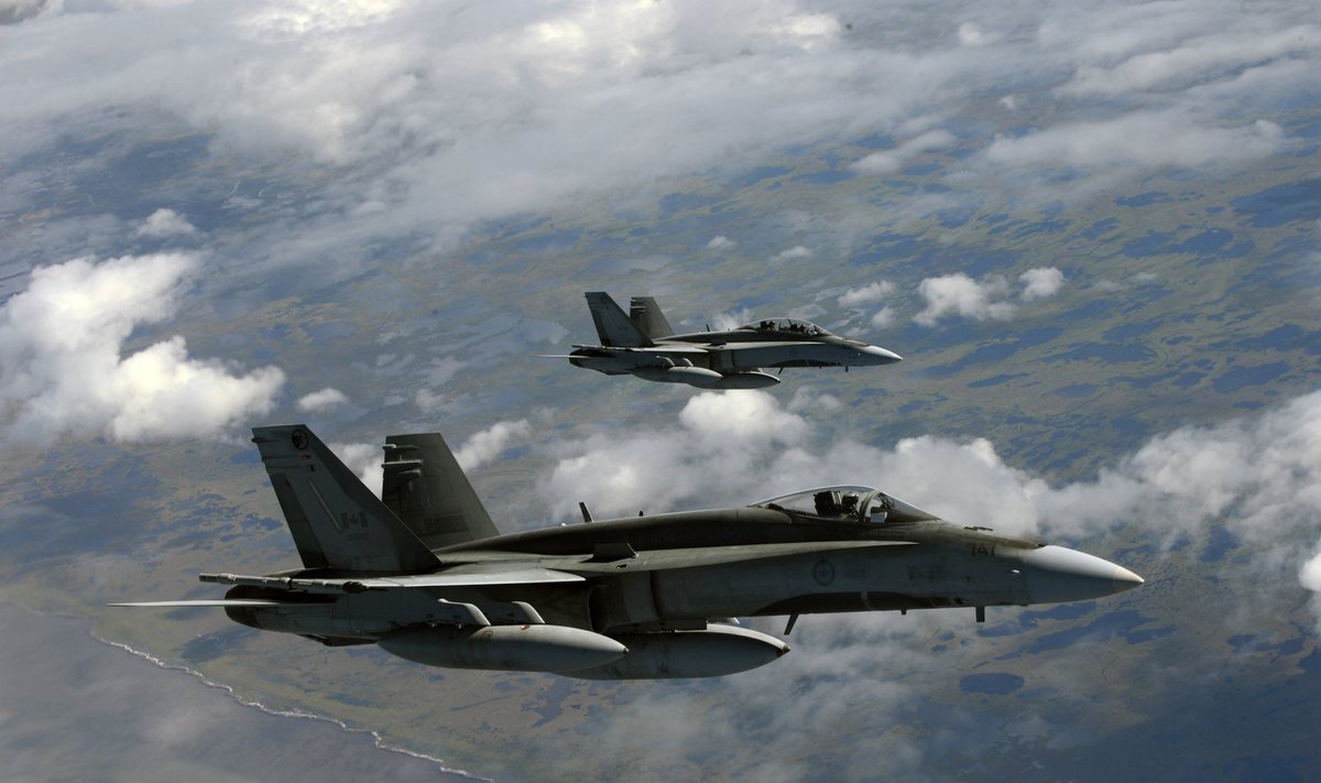 RCAF CF-18 Hornet aircraft fly a mission over Joint Base Elmendorf-Richardson, Alaska