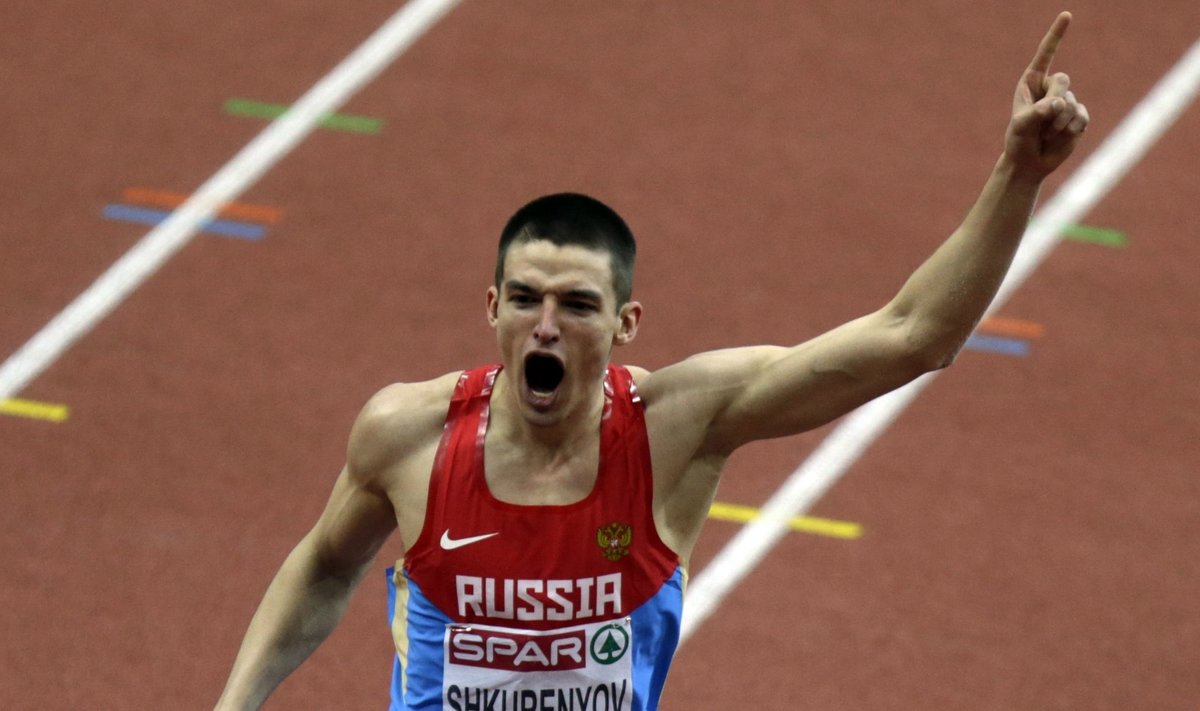 Shkurenyov of Russia celebrates after competing in the men's heptathlon long jump event during the IAAF European Indoor Championships in Prague
