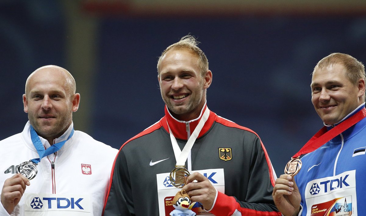 Gold medallist Harting of Germany poses with other medallists at the men's discus throw victory ceremony during the IAAF World Athletics Championships at the Luzhniki stadium in Moscow