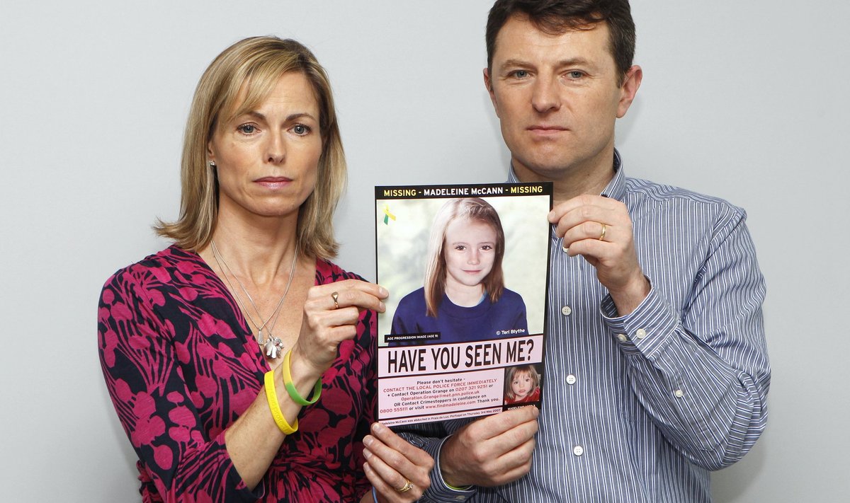 Kate and Gerry McCann pose with a computer generated image of how their missing daughter Madeleine might look now, during a news conference in London