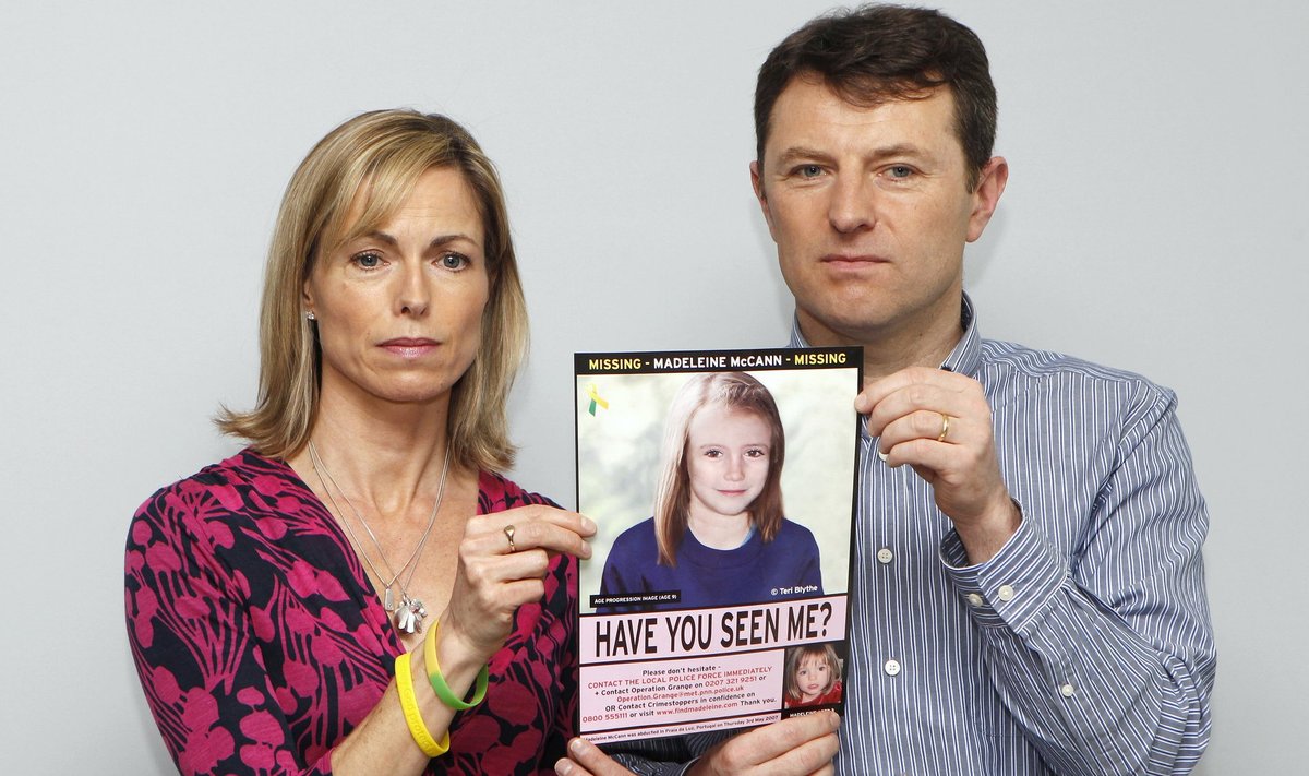 Kate and Gerry McCann pose with a computer generated image of how their missing daughter Madeleine might look now, during a news conference in London