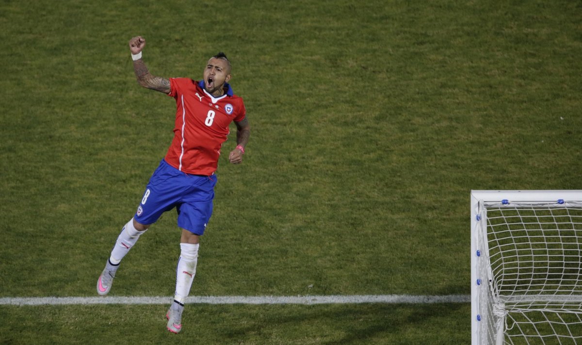 Chile's Arturo Vidal celebrates after scoring his penalty kick during a shootout against Argentina in the Copa America 2015 final soccer match at the National Stadium in Santiago