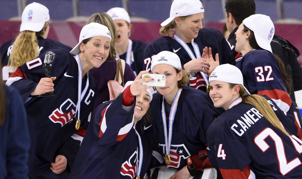 Team USA players pose for a selfie after winning the 2015 IIHF Ice Hockey Women's World Championship gold medal match between USA and Canada at Malmo Isstadion in Malmo