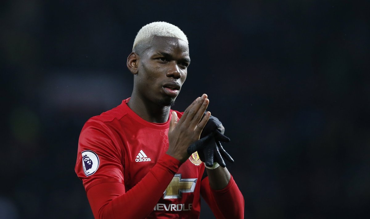 Manchester United's Paul Pogba applauds fans after the game