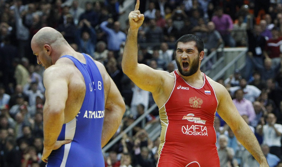 Makhov of Russia celebrates his victory over Taymazov of Uzbekistan in their 120 kg men's free style gold medal match at the World Wrestling Championships in Moscow