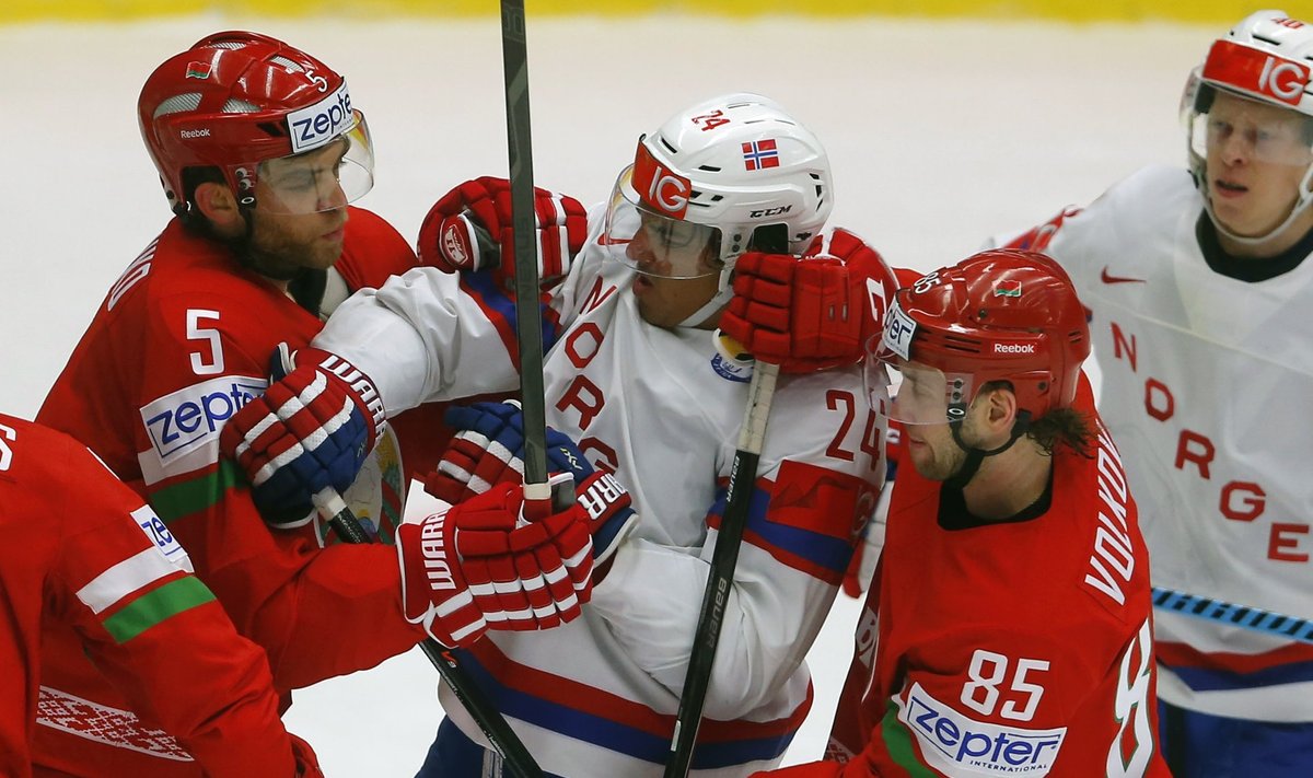 Stasenko and Volkov of Belarus scuffle with Norway's Martinsen during their Ice Hockey World Championship game at the CEZ arena in Ostrava
