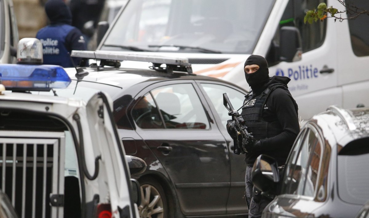 File photo of Belgian police being seen outside of a house during a search of suspected muslim fundamentalists linked to the deadly attacks in Paris, in the Brussels suburb of Molenbeek