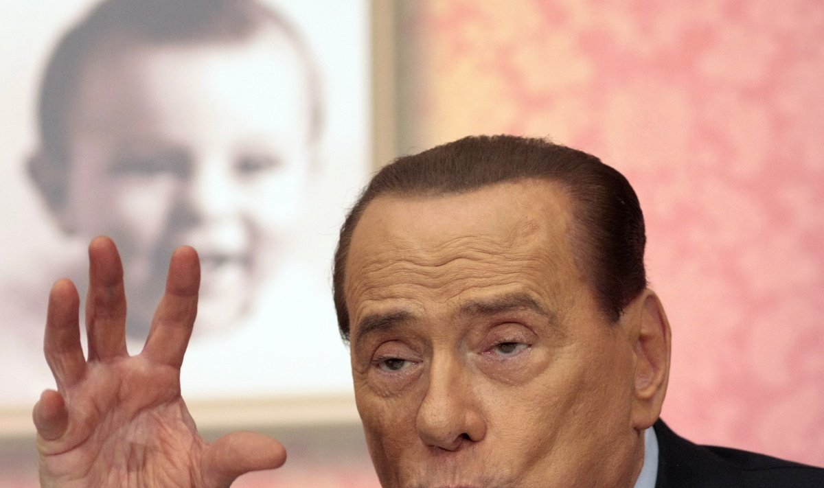 Former Italian PM Berlusconi gestures as he attends the launch of a book "Sale, zucchero e caffe'"by journalist Bruno Vespa, in downtown Rome