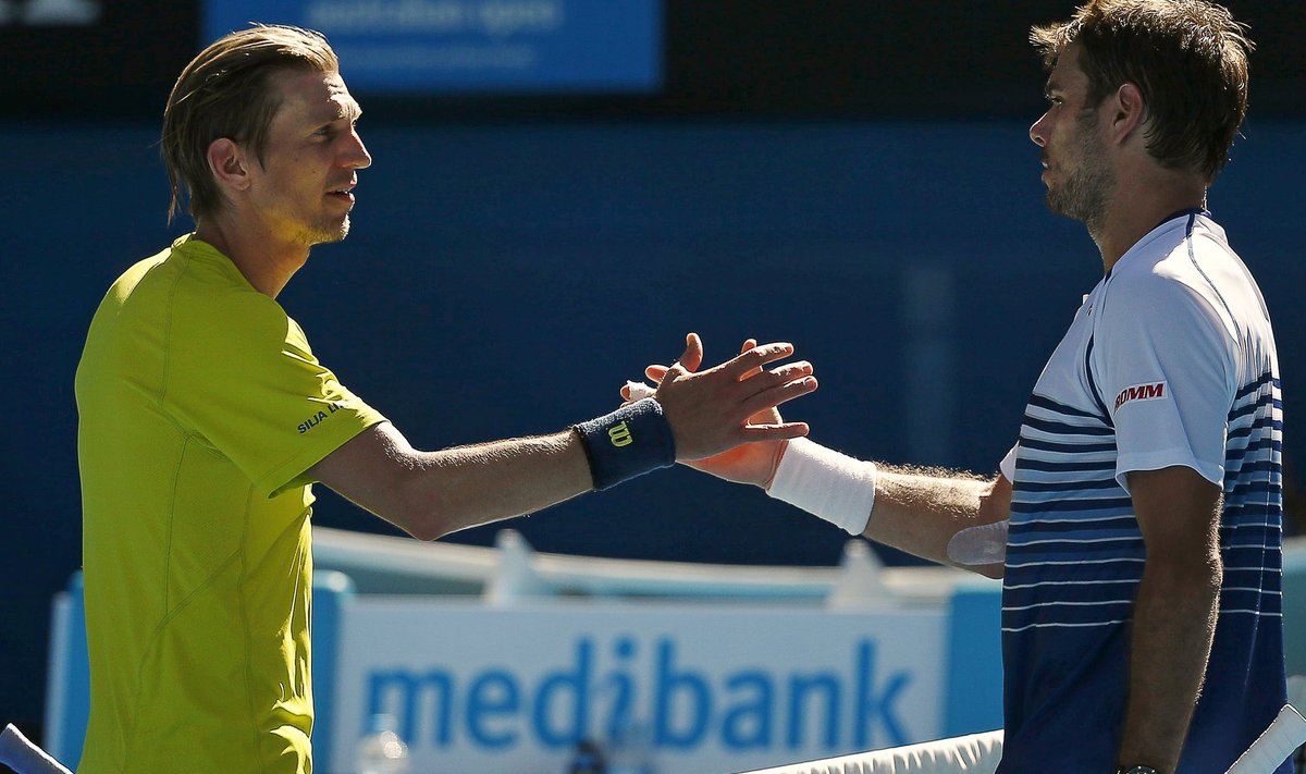 Wawrinka of Switzerland shakes hands with Nieminen of Finland after winning their men's singles match at the Australian Open 2015 tennis tournament in Melbourne