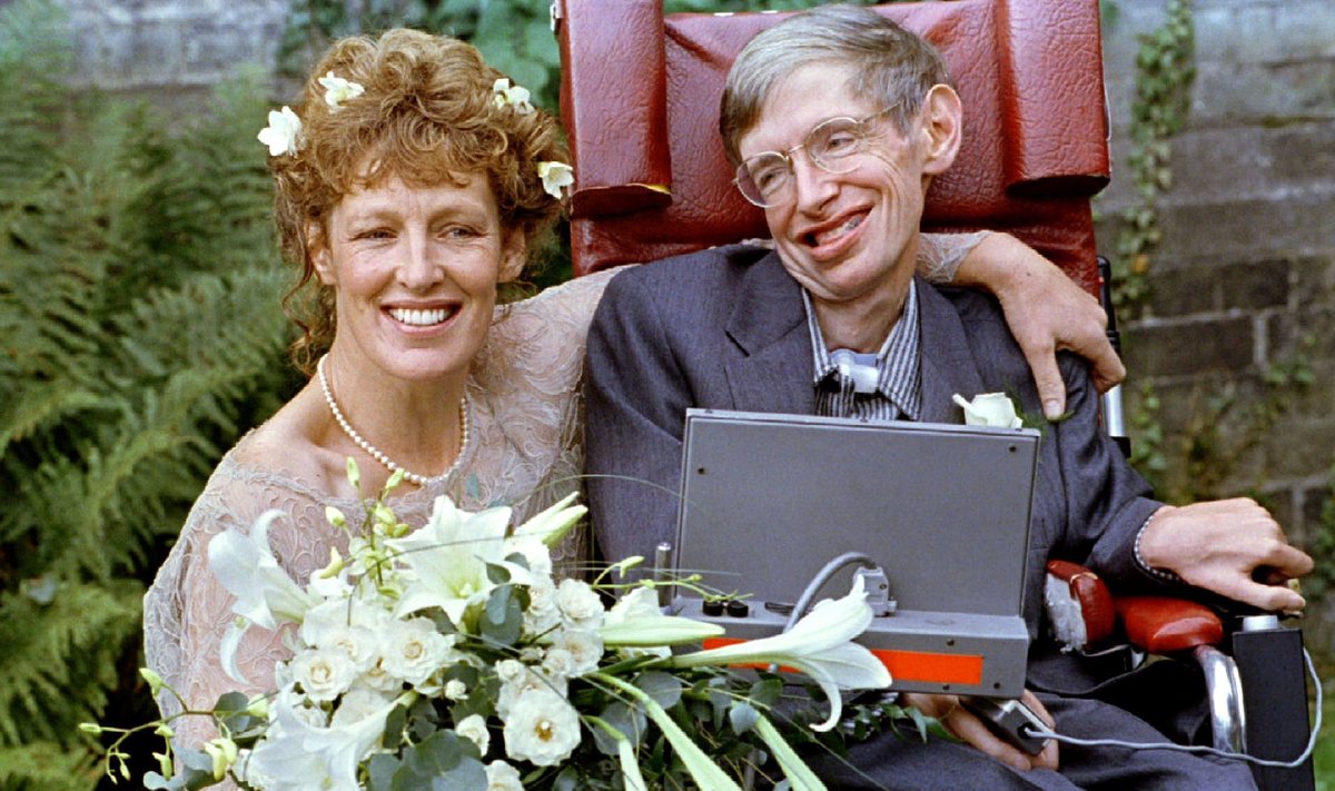 FILE PHOTO: 1995 Stephen Hawking and his new bride Elaine Mason pose for pictures after the blessing of their wedding at St. Barnabus Church