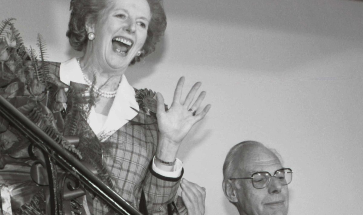 File photo of Britain's Prime Minister Thatcher giving a jubilant wave from the stairs inside her Conservative party headquarters