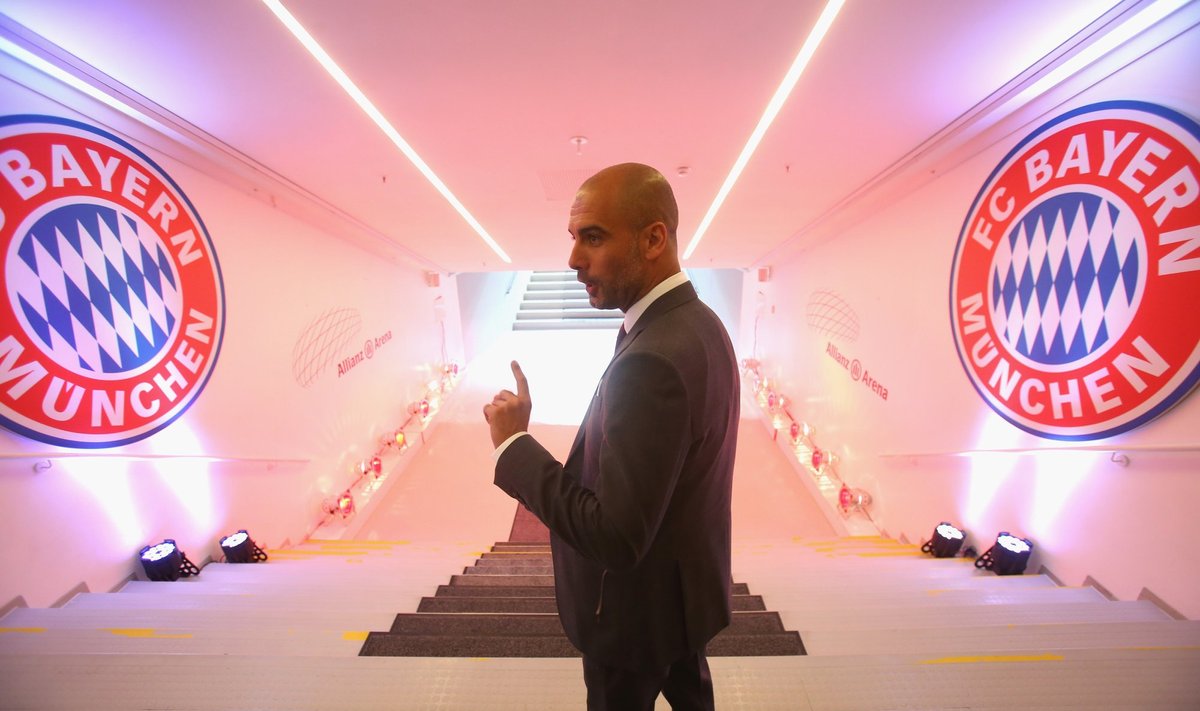 Pep Guardiola, new coach of German first division football club Bayern Munich, walks through the players' tunnel to the pitch of the Allianz Arena stadium on June 24, 2013 in Munich, southern Germany. Guardiola is taking over as head coach and replaces Jupp Heynckes, who won with the club the German League (Bundesliga), the German Cup (DFB Pokal) and the UEFA Champions League in the last season. AFP PHOTO / POOL / ALEXANDER HASSENSTEIN
