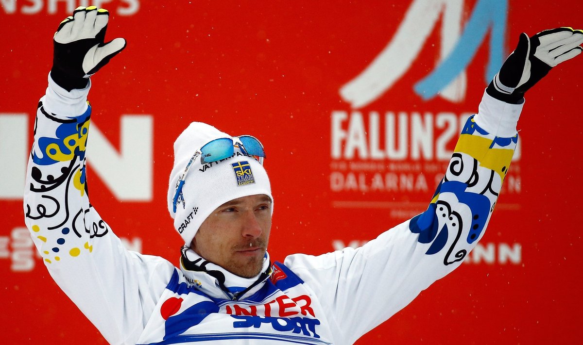 Sweden's Johan Olsson celebrates his third place in the men's cross country 50 km mass start classic race at the Nordic World Ski Championships in Falun