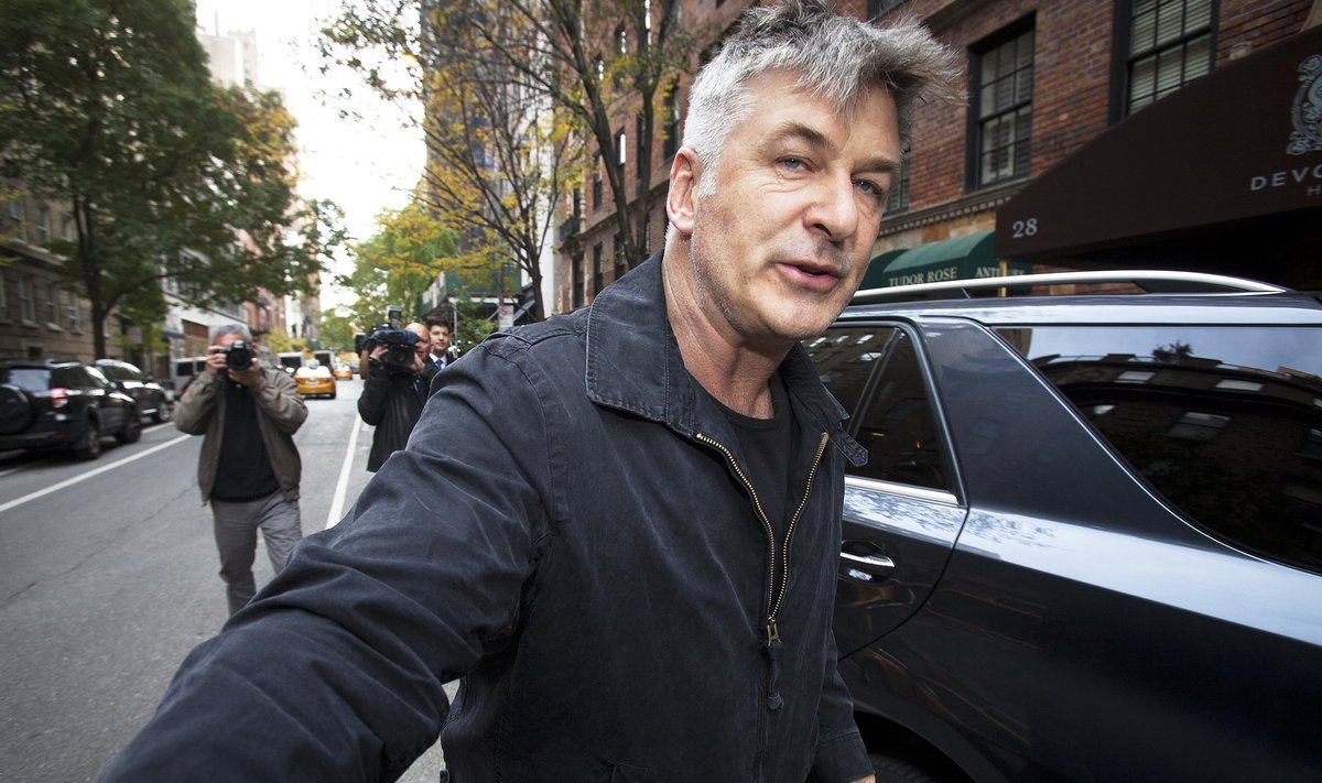 Actor Alec Baldwin shoves a photographer and tells him to move out of his way after he arrived in his SUV at the building where he lives in New York in this file photo