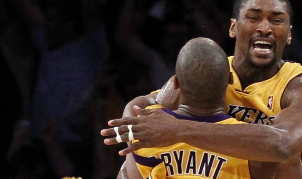 Los Angeles Lakers forward Ron Artest jumps into the arms of team-mate Kobe Bryant after scoring the game-winning basket against the Phoenix Suns with less than 1 second on the clock during Game 5 of their NBA Western Conference final playoffs in Los Angeles May 27, 2010. REUTERS/Lucy Nicholson (UNITED STATES - Tags: SPORT BASKETBALL IMAGES OF THE DAY)