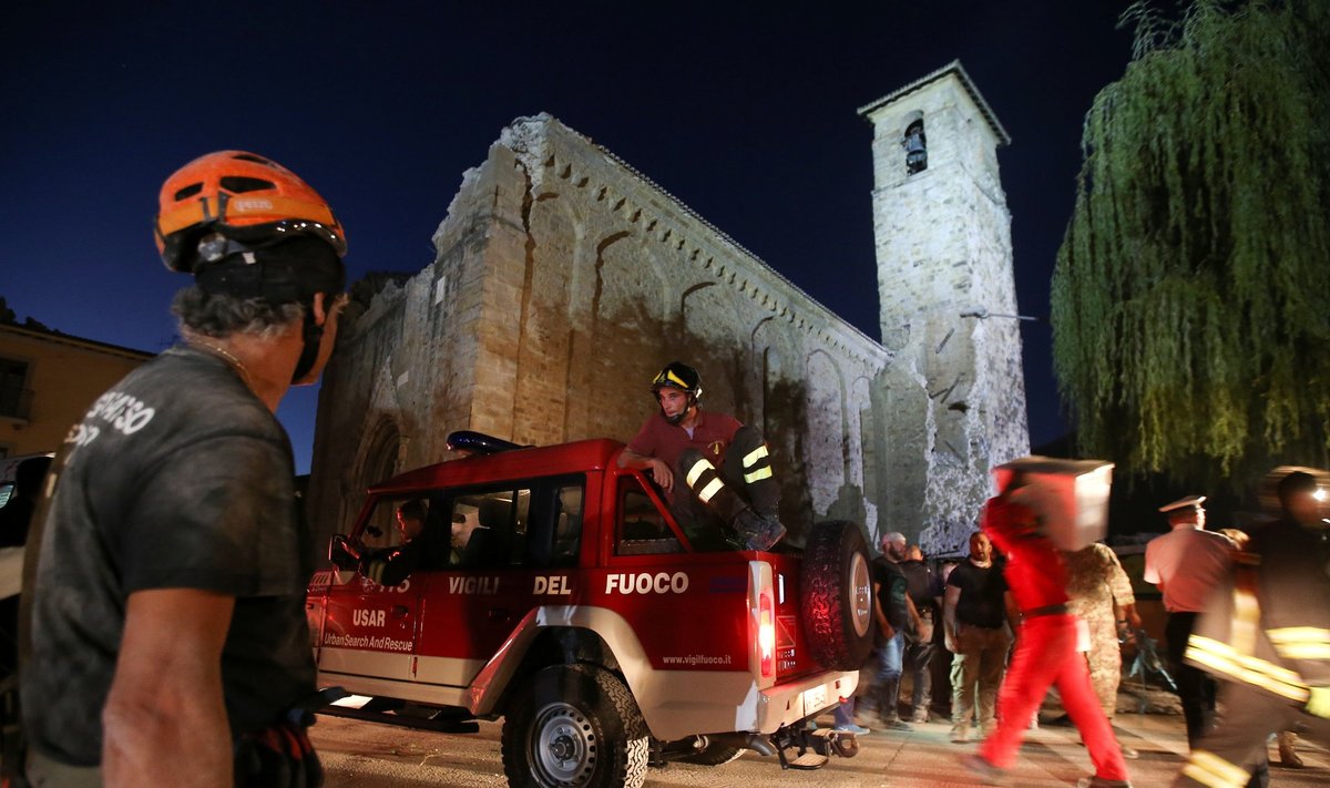 Rescuers work following the earthquake in Amatrice