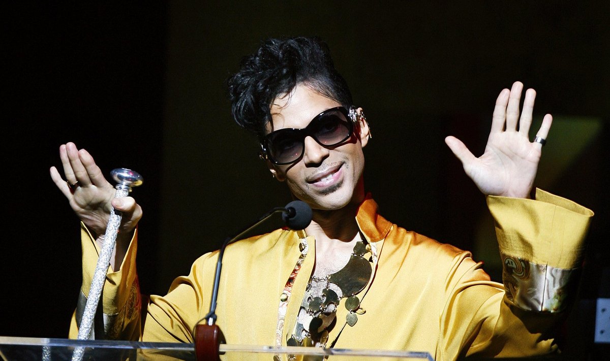 Musician Prince gestures on stage during Apollo Theatre's 75th anniversary gala in New York
