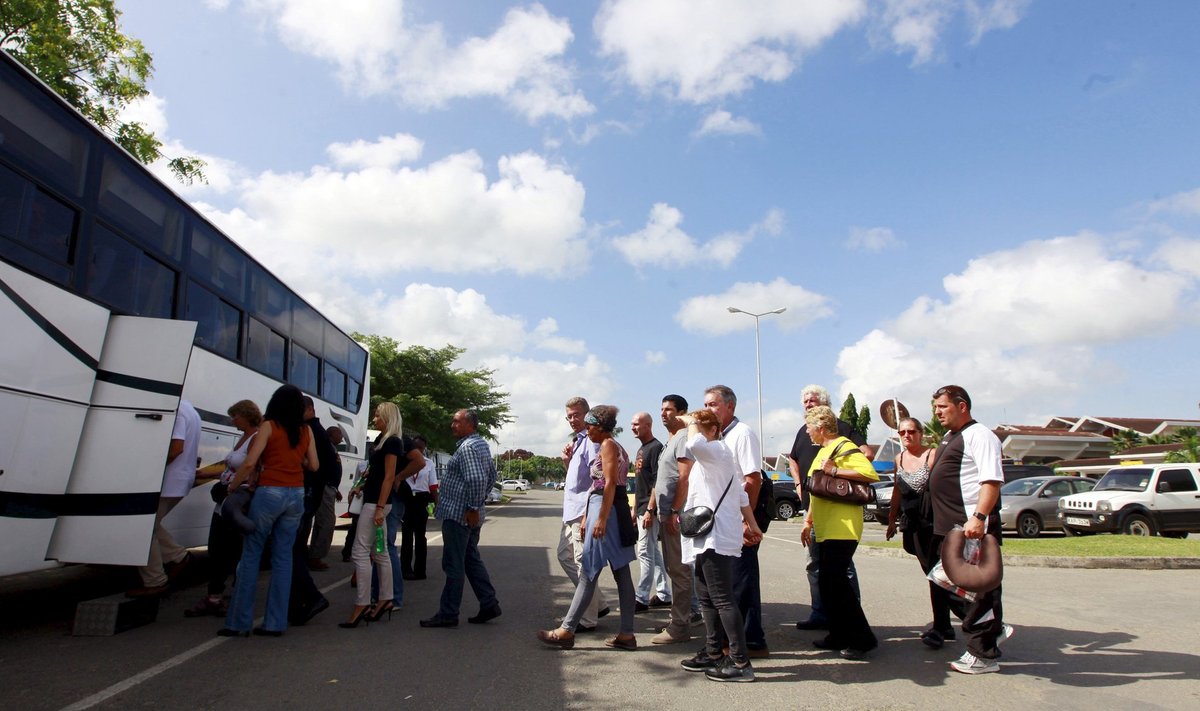 Passengers who were onboard an Air France Boeing 777 aircraft that made an emergency landing board a bus as they are escorted to hotels from Moi International Airport in Kenya's coastal city of Mombasa