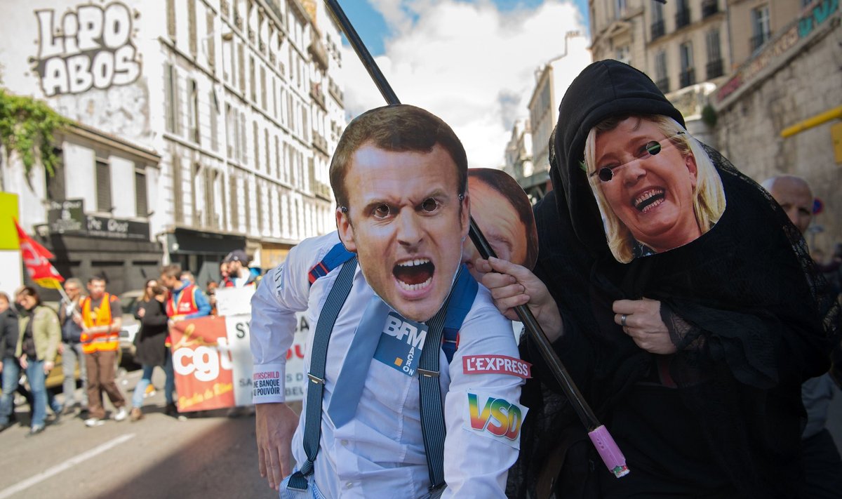 Macroni ja Le Peni maskidega meeleavaldajad Marseille’ maiparaadil
