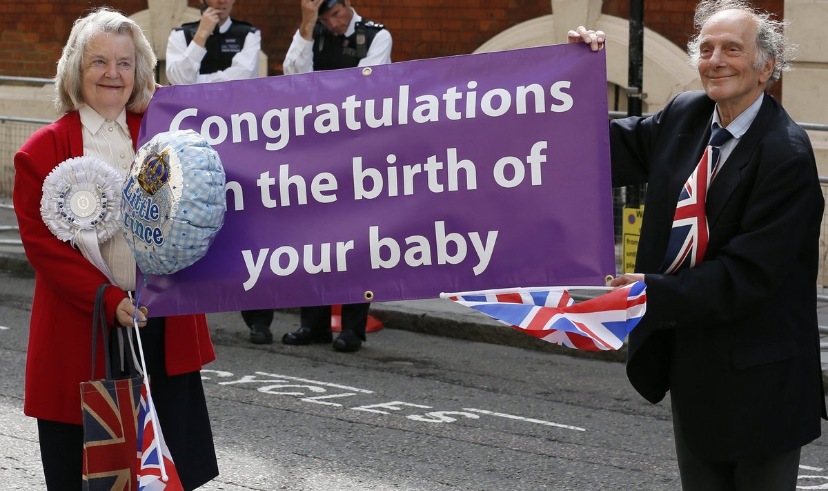 Well-wishers hold a sign in front of the Lindo Wing of St Mary's Hospital, the morning after Britain's Catherine, Duchess of Cambridge gave birth to a baby boy in London
