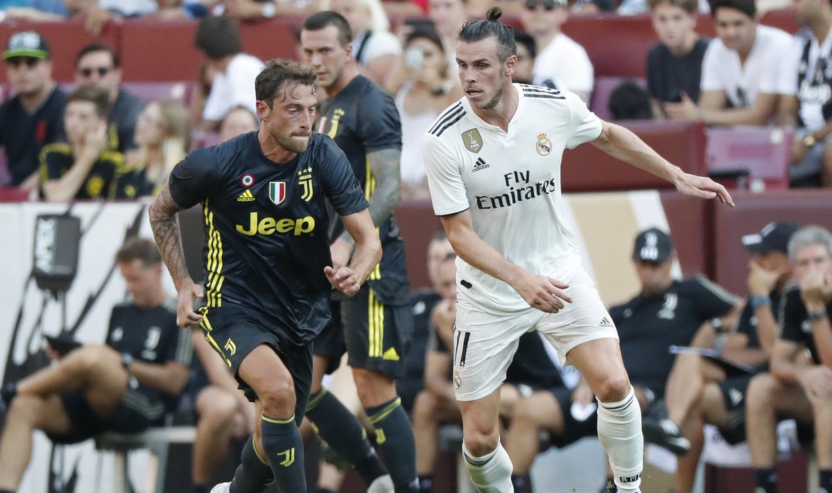 Claudio Marchisio ning Gareth Bale võitlemas palli pärast