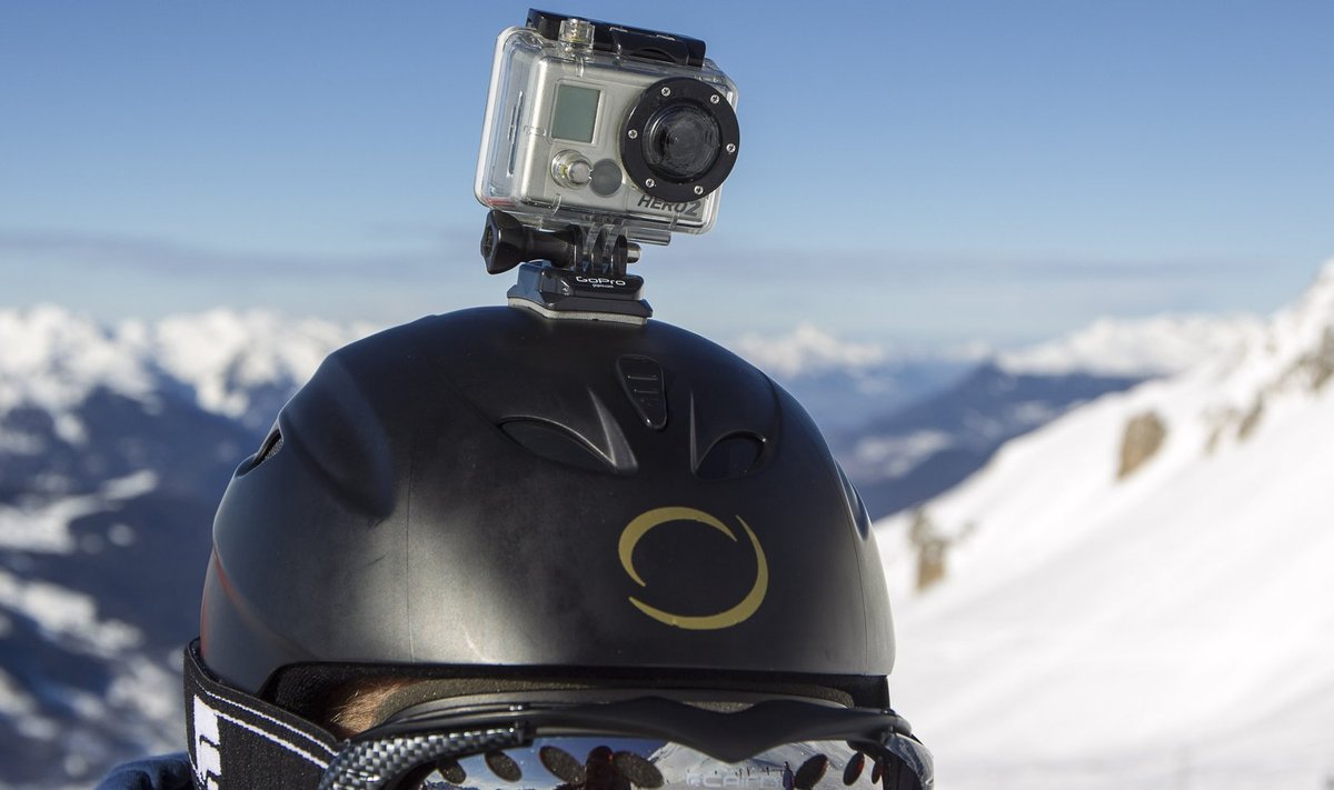 A skier wears a GoPro camera on his helmet as he rides down the slopes in the ski resort of Meribel