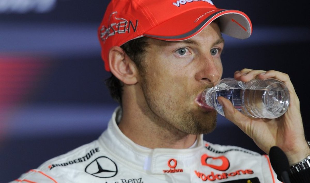 McLaren Formula One driver Jenson Button of Britain takes a drink during a press conference after winning the Australian Formula One Grand Prix in Melbourne,Sunday, March 28, 2010. (AP Photo/Andrew Brownbill) / SCANPIX Code: 436