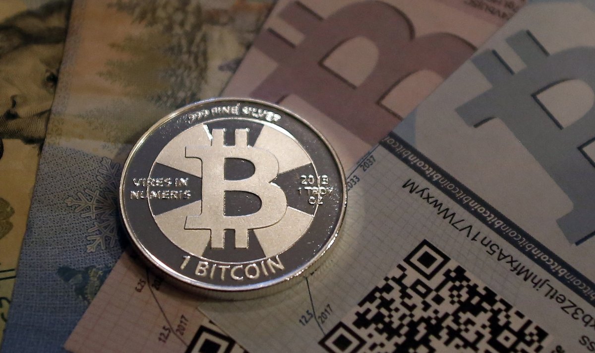 One of Bitcoin enthusiast Mike Caldwell's coins in this photo illustration at his office in Sandy