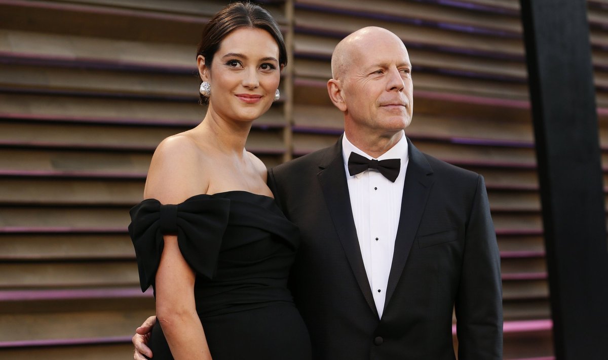 Actor Bruce Willis and his wife Emma Heming arrive at the 2014 Vanity Fair Oscars Party in West Hollywood