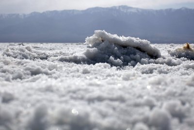 Salt lies on the ground at Badwater Salt Flats in Death Valley National Park
