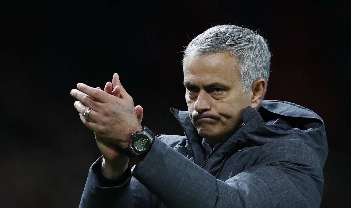 Manchester United manager Jose Mourinho applauds fans after the match