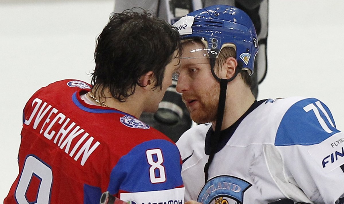 Russia's Ovechkin and Finland's Komarov shake hands after their 2012 IIHF men's ice hockey World Championship semi-final game in Helsinki