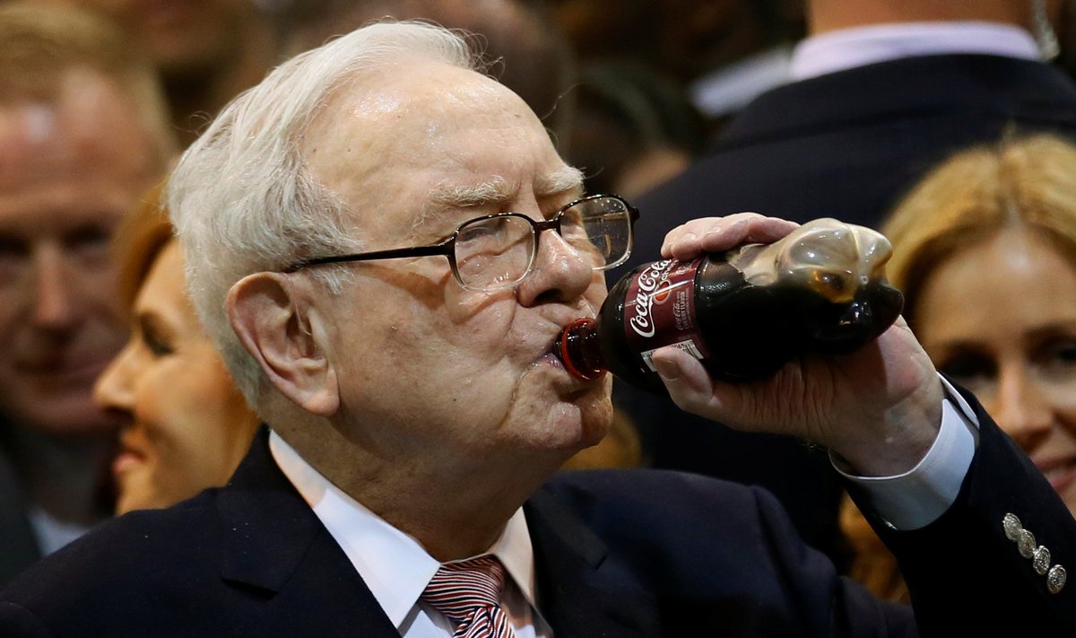 Berkshire Hathaway chairman and CEO Warren Buffett enjoys his favourite beverage, cherry Coke, before the Berkshire Hathaway annual meeting in Omaha