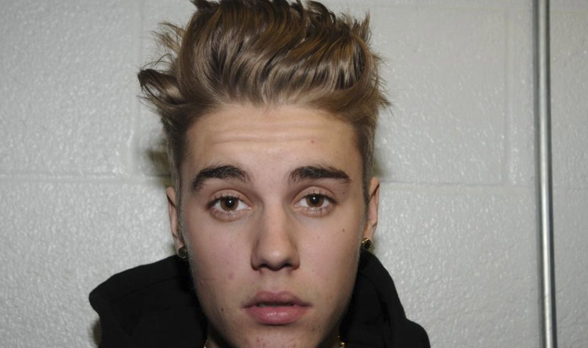 Handout shows Canadian pop singer Justin Bieber in police custody in Miami Beach, Florida