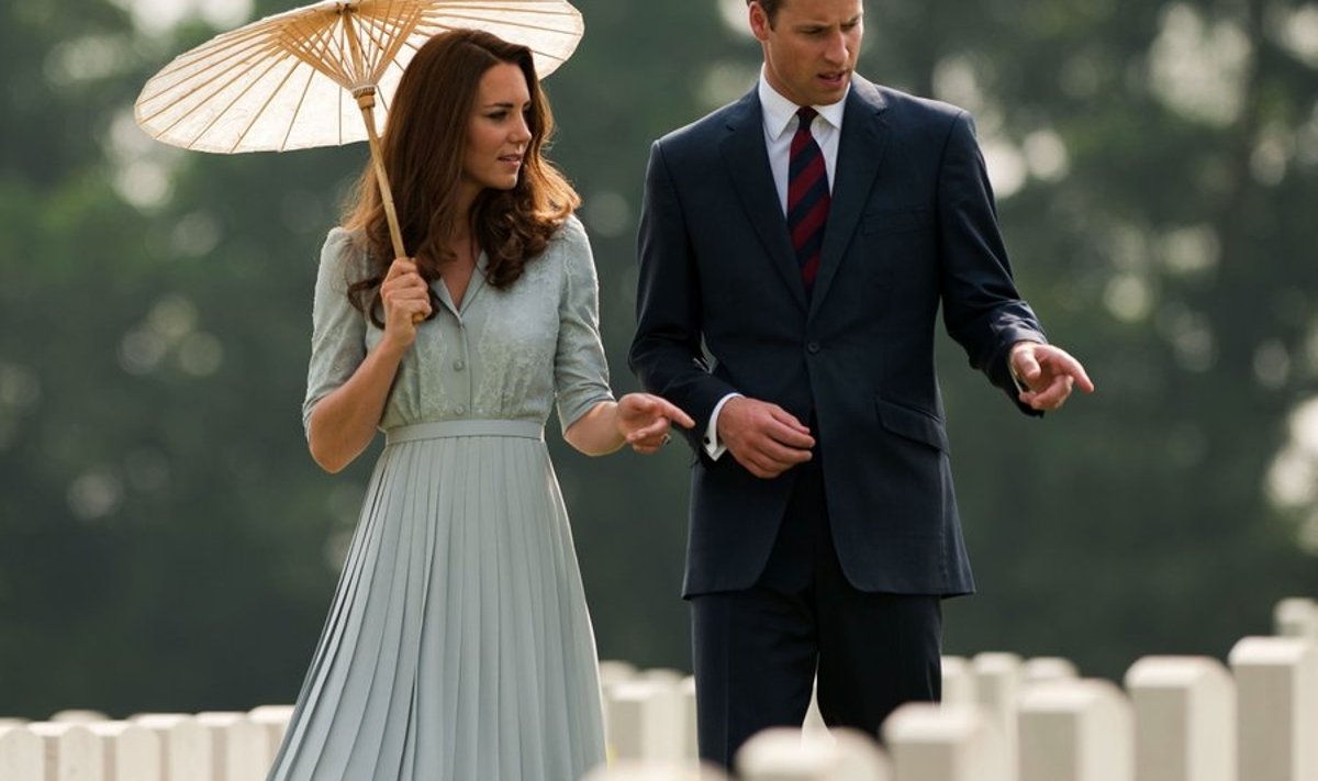Britain's Prince William (R) and his wife Catherine, the Duchess of Cambridge, look at the headstones as they visit the Kranji Memorial Cemetery in Singapore on September 13, 2012. Britain's Prince William and his wife Catherine arrived in Singapore on September 11 to kick off a nine-day Southeast Asian and Pacific tour marking Queen Elizabeth II's Diamond Jubilee. The Kranji Memorial Cemetery is a WWII memorial and final resting place for allied forces who perished there. AFP PHOTO/ Nicolas ASFOURI