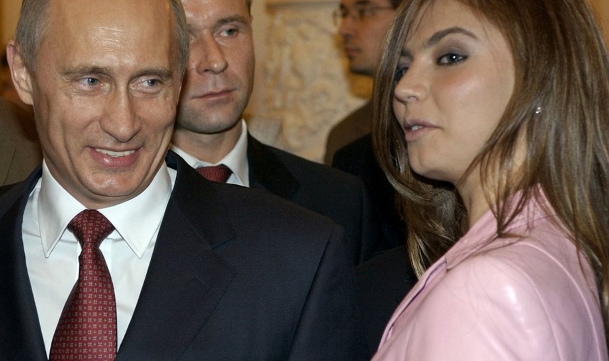 ** FILE ** In this Nov. 4, 2004 file photo, President Vladimir Putin, left, speaks with gymnast Alina Kabayeva as he hosts Russia's Olympic athletes at a Kremlin banquet in Moscow. Russian President Vladimir Putin on Friday denied a tabloid report that he had divorced his wife and intended to marry a champion gymnast less than half his age. (AP Photo/ITAR-TASS, Presidential Press Service) / SCANPIX Code: 436