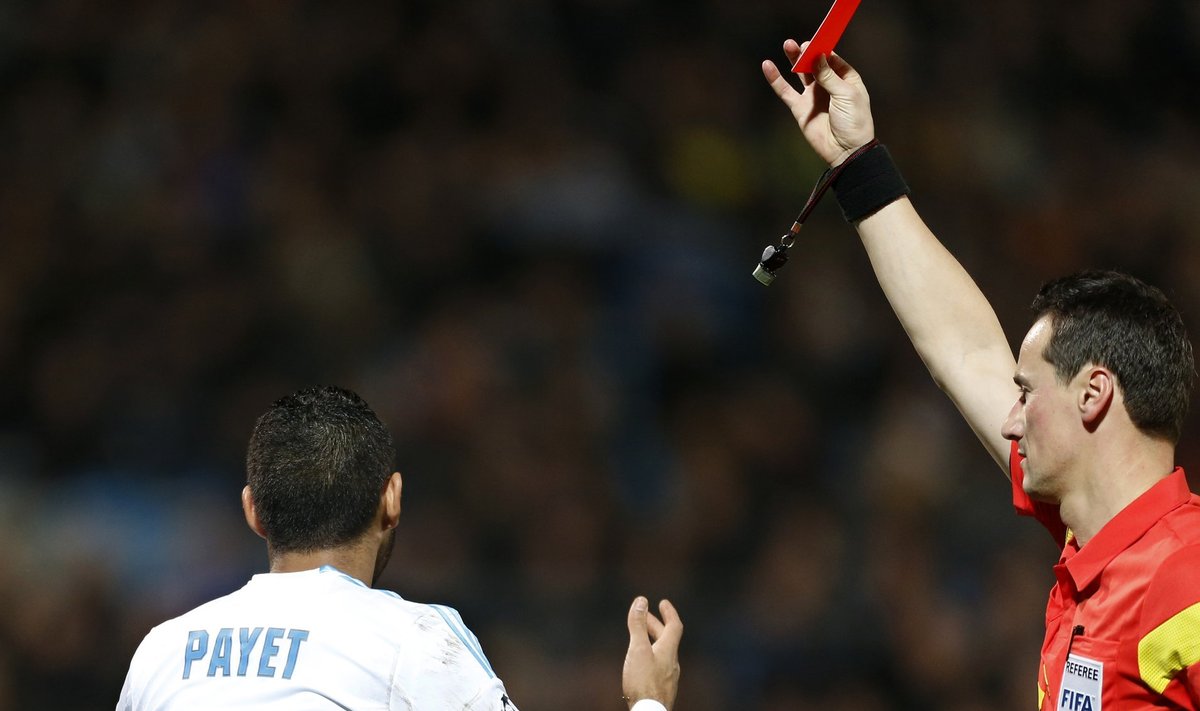 Referee Strahonja shows a red card to Olympique Marseille's Payet during their Champions League soccer match against Borussia Dortmund in Marseille