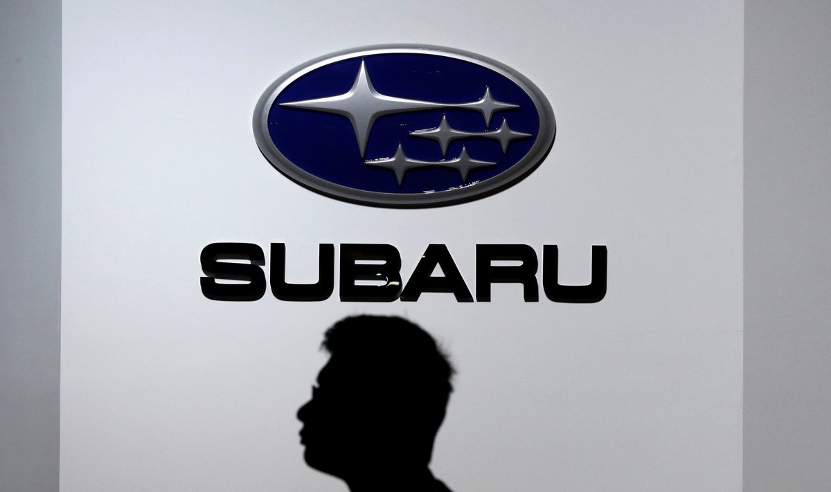 A man walks past the logo of Subaru Corp at the 45th Tokyo Motor Show in Tokyo