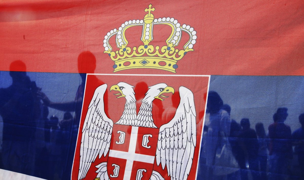 Kosovo Serbs hold Serbian national flag during event to mark anniversary of 1389 Battle of Kosovo at Gazimestan, near Pristina