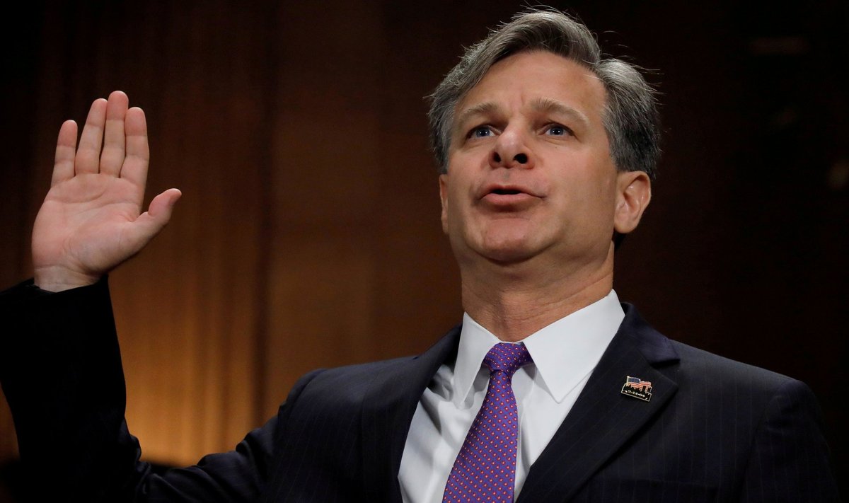 FILE PHOTO - Wray is sworn in prior to testifying before Senate Judiciary Committee confirmation hearing on Capitol Hill in Washington